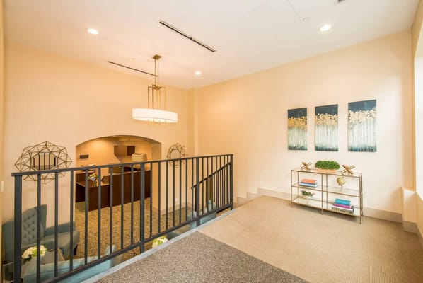 Bright interior lobby area with seating and artwork
