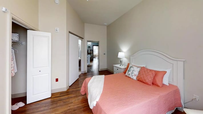 Private resident room with a cozy bed and decor