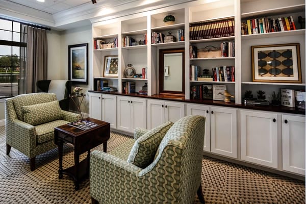 Cozy common area with bookshelves and seating
