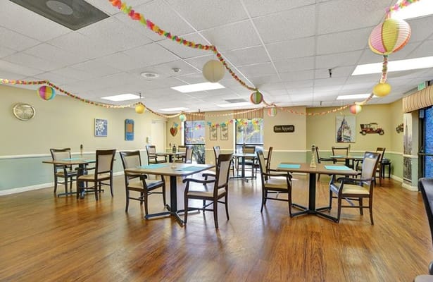 Dining area decorated for a celebration with colorful lanterns