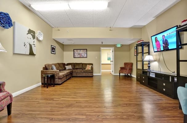 A common area with seating and a TV