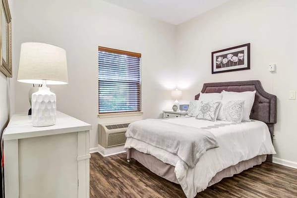Cozy interior of a private resident room with a bed