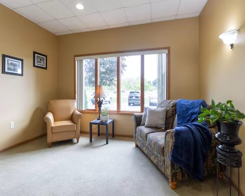 Cozy common area with seating and natural light