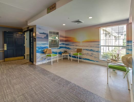 Bright interior common area with beach mural