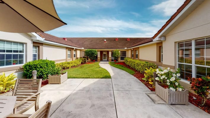 Beautiful outdoor courtyard with walking path and greenery