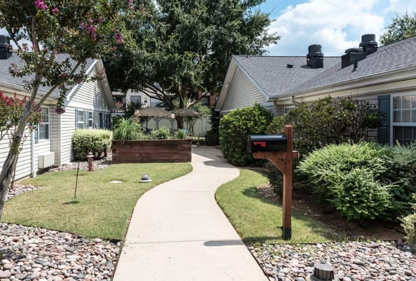 A pathway through a landscaped courtyard at the facility