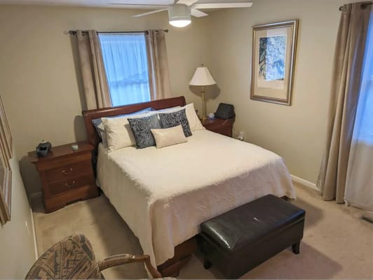 Cozy private resident room with bed and furnishings