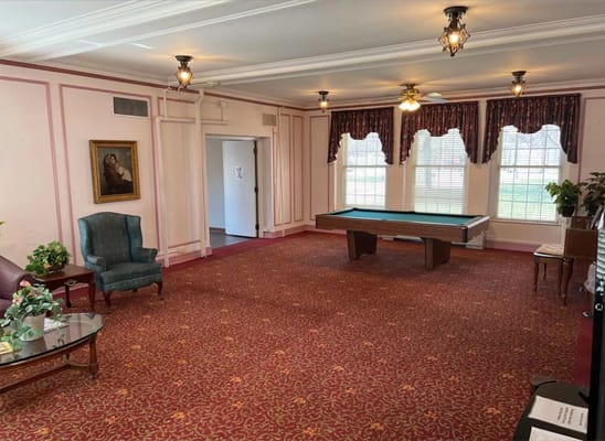 Common area with pool table and seating