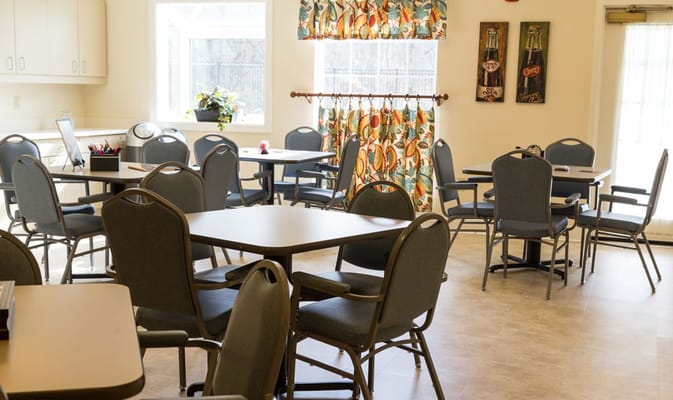 Interior view of a common area with tables and chairs