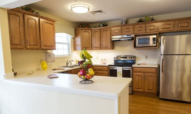 Bright kitchen with fruit arrangement on counter