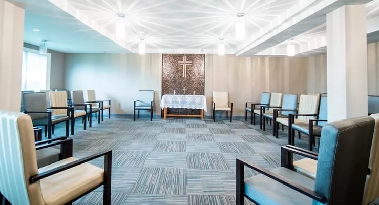 Bright common area with chairs arranged around a table