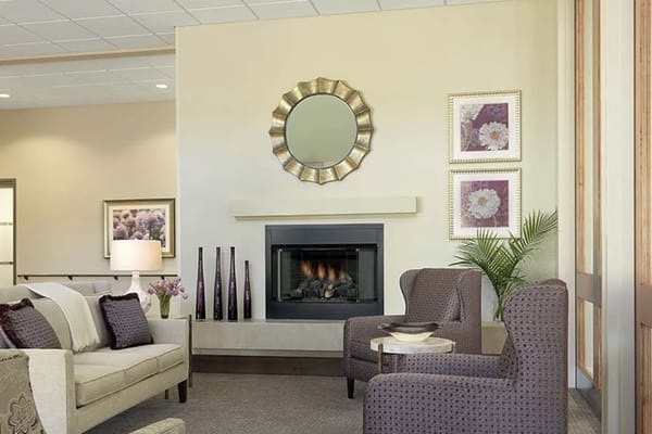 Cozy common area with comfortable seating and a fireplace