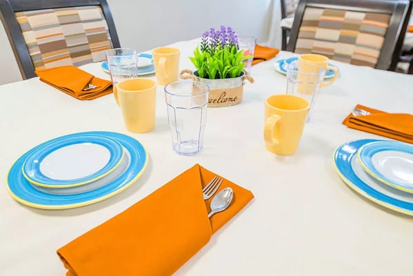 Dining table set with plates and drinks