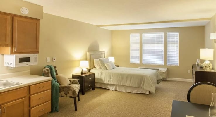 Cozy private resident room with bed and kitchenette