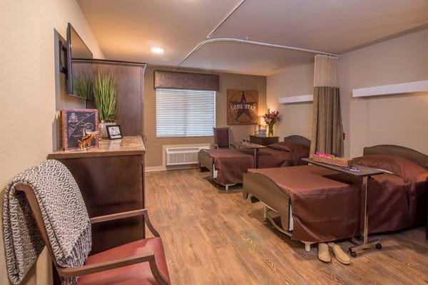 A well-furnished resident room with two beds