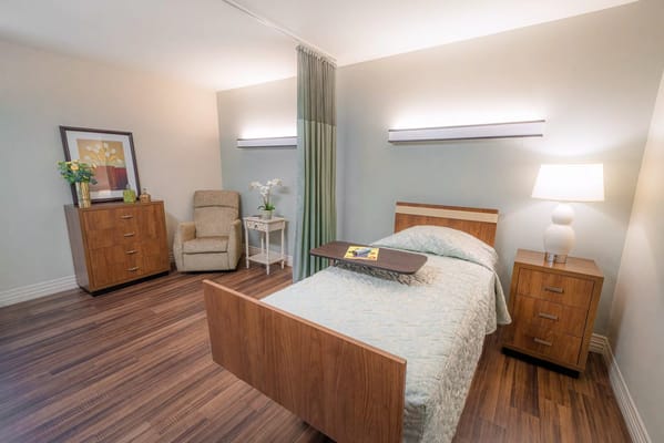 Cozy private room with bed and chair