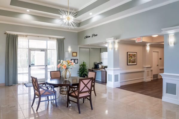 Bright common area with seating and plants