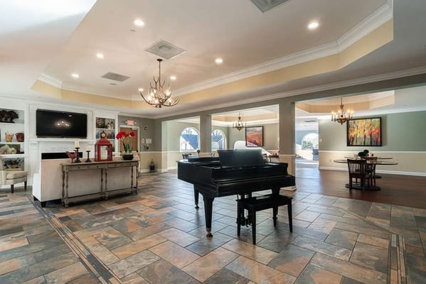 Interior view of a common area with a piano