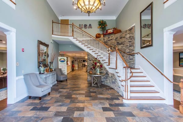 Bright and welcoming lobby with a staircase