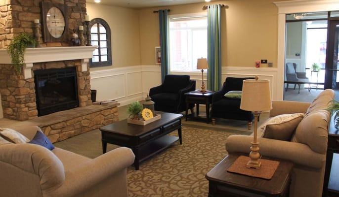 Cozy common area with seating and a fireplace