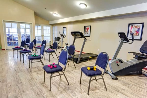 Interior fitness area with exercise equipment and weights