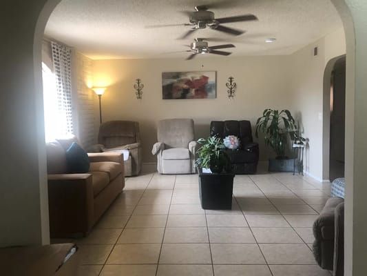 Bright common area with seating and plants