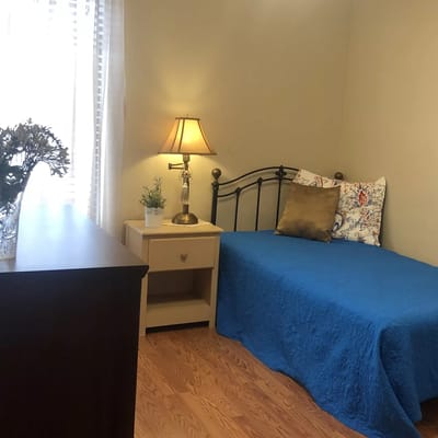 Cozy private room with single bed and lamp