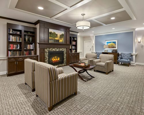 Cozy common area with comfortable seating and bookshelves