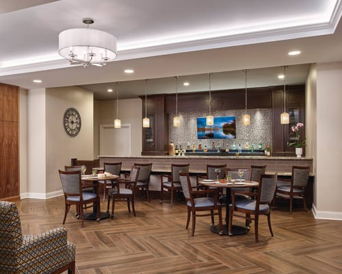 Common area with seating and a bar.