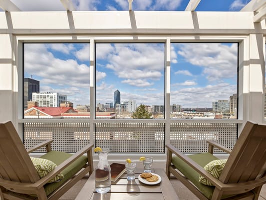 Bright common area with a city view and snacks.