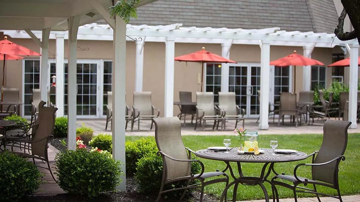 Outdoor patio with tables and umbrellas