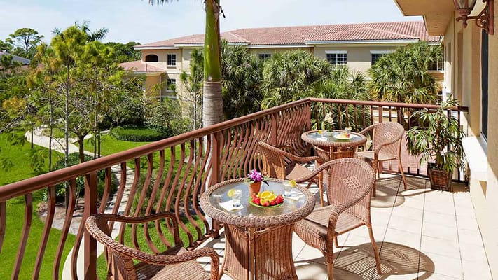 Outdoor seating area with tables and refreshments