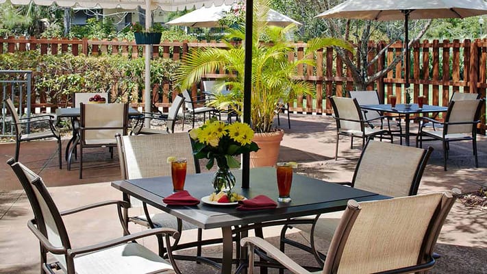 Outdoor dining area with tables and chairs