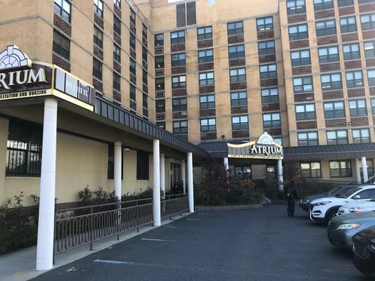Entrance of Atrium Center with parking area