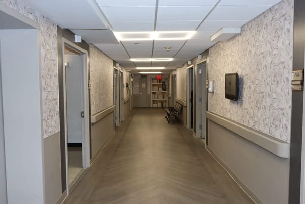 Interior hallway with patterned walls and seating area