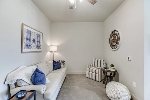 Stylish interior living room with sofa and clock