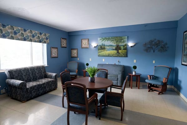 Comfortable lounge area with seating and artwork