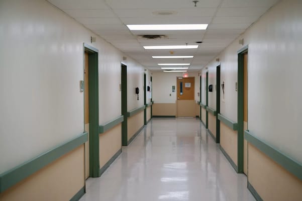 Well-lit hallway in a senior living facility