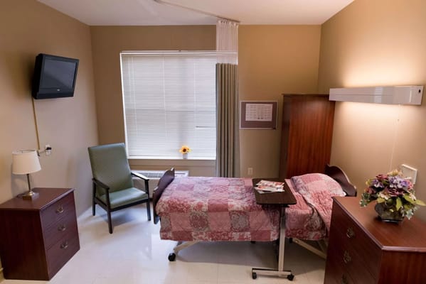 Private resident room with a bed and furniture