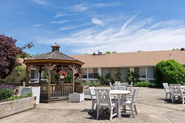 Outdoor seating area with gazebo and gardens
