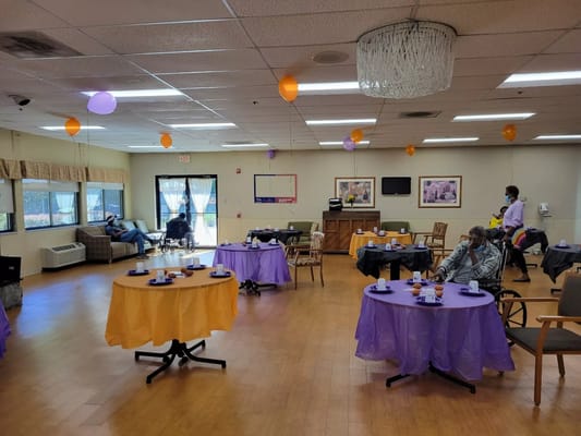 Residents enjoying a decorated activity room