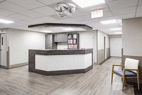 Reception area with a modern counter and decor