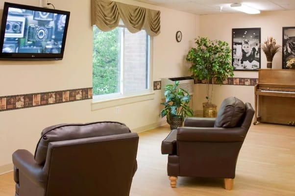 Common area with seating and television
