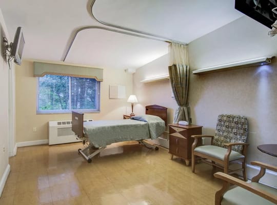 Private resident room with bed and seating area