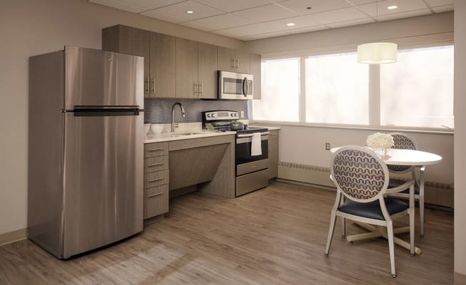 Bright, modern kitchenette in a resident unit