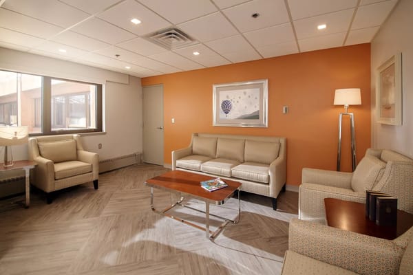 Cozy common area with seating and artwork