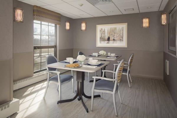 Bright dining area with tables set for a meal