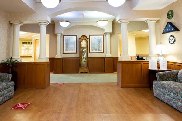 Interior view of a nursing home lobby with seating and décor