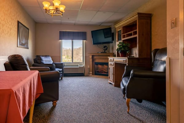 Common area with seating and a view at Autumn Lake Healthcare.