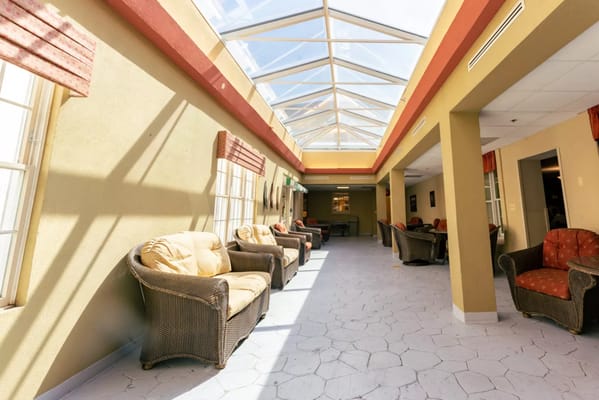 Interior common area with natural light and seating